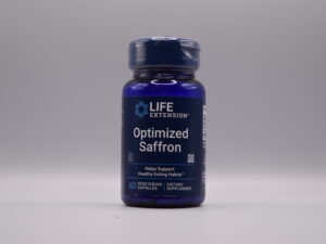 A bottle of Optimized Saffron dietary supplement capsules on a neutral background.
