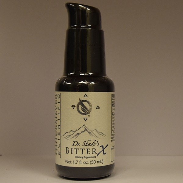 A bottle of dr. shade's bitterx dietary supplement on a neutral background.