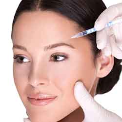 A woman receiving a Cosmetic PRP with Ozone injection near her forehead, possibly a beauty treatment like botox or filler.