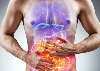 A man clutching his stomach with a superimposed graphic illustrating internal organs, highlighting potential digestive discomfort or pain.