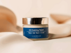 O3 Evening Reset jar displayed on peachy silk fabric, creating a serene and elegant nighttime skincare mood.