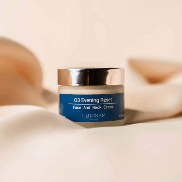 O3 Evening Reset jar displayed on peachy silk fabric, creating a serene and elegant nighttime skincare mood.