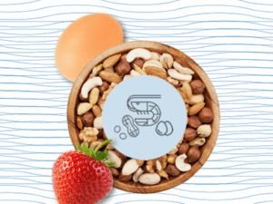 Bowl of assorted nuts with egg and strawberry, representing common food sensitivities.