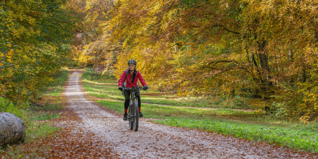Woman enjoying a bike ride, symbolizing energy, balance, and naturopathic health at Lake Oswego Health Center in Lake Oswego, Oregon.