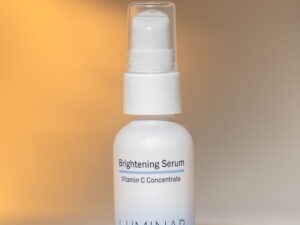 Brightening serum aganist a soft light background.